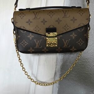 Louis Vuitton Pochette Métis East West Reverse Monogram Canvas